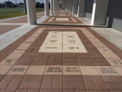 Engraved brick walkway with columns
